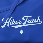 Blue shirt with 'Hiker Trash' text and a tree logo on a blue background