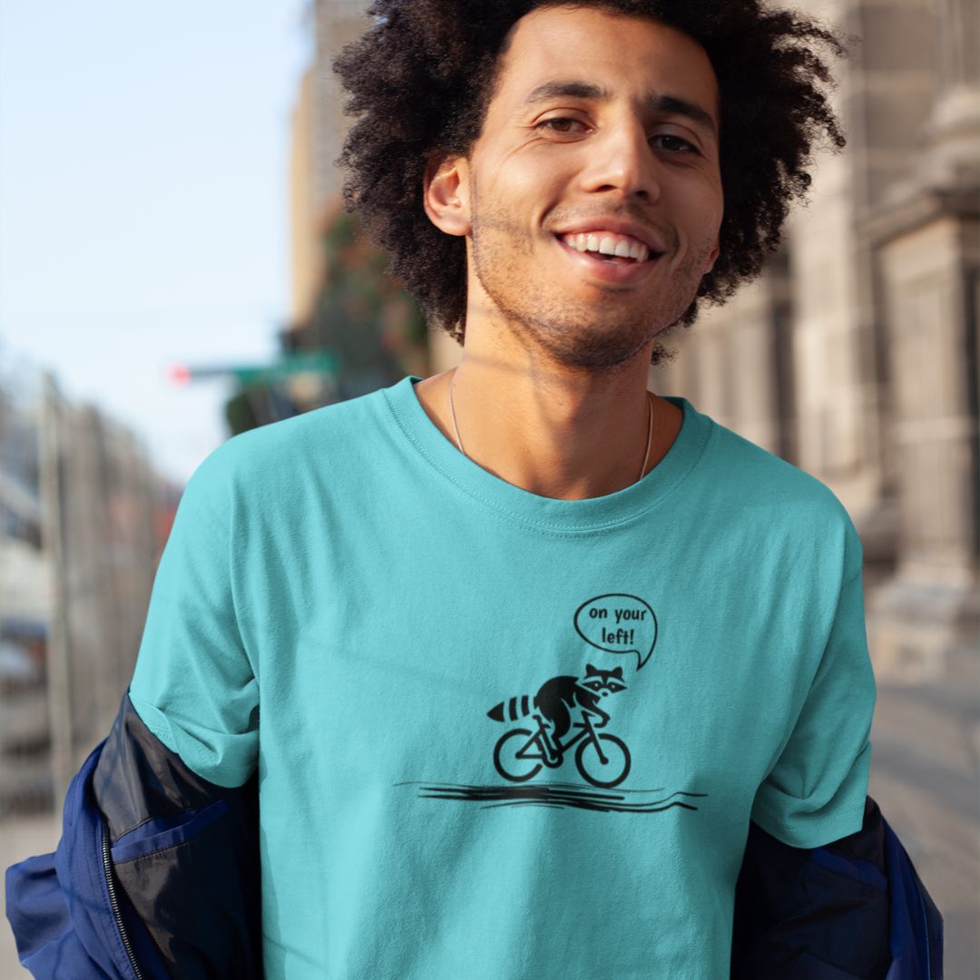 Man wearing On Your Left Raccoon turquoise cycling t-shirt bike humor
