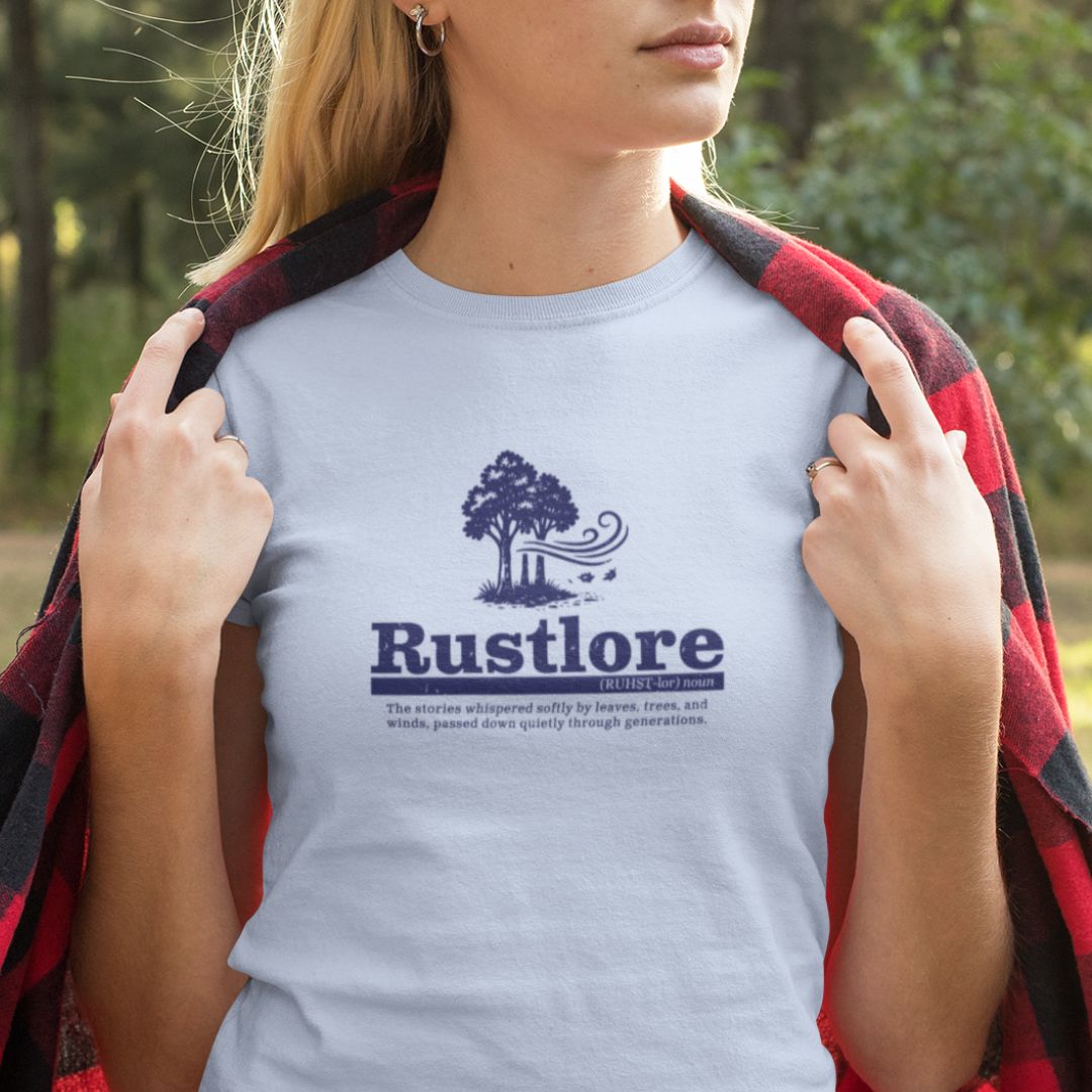 Woman wearing Rustlore Forest baby blue nature t-shirt outdoor lifestyle
