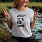 Woman wearing Voices of the People light blue protest music tee
