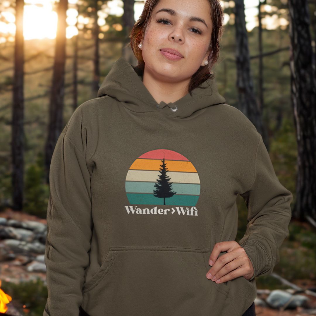 Woman wearing Wander is Greater than Wifi military green hoodie outdoors
